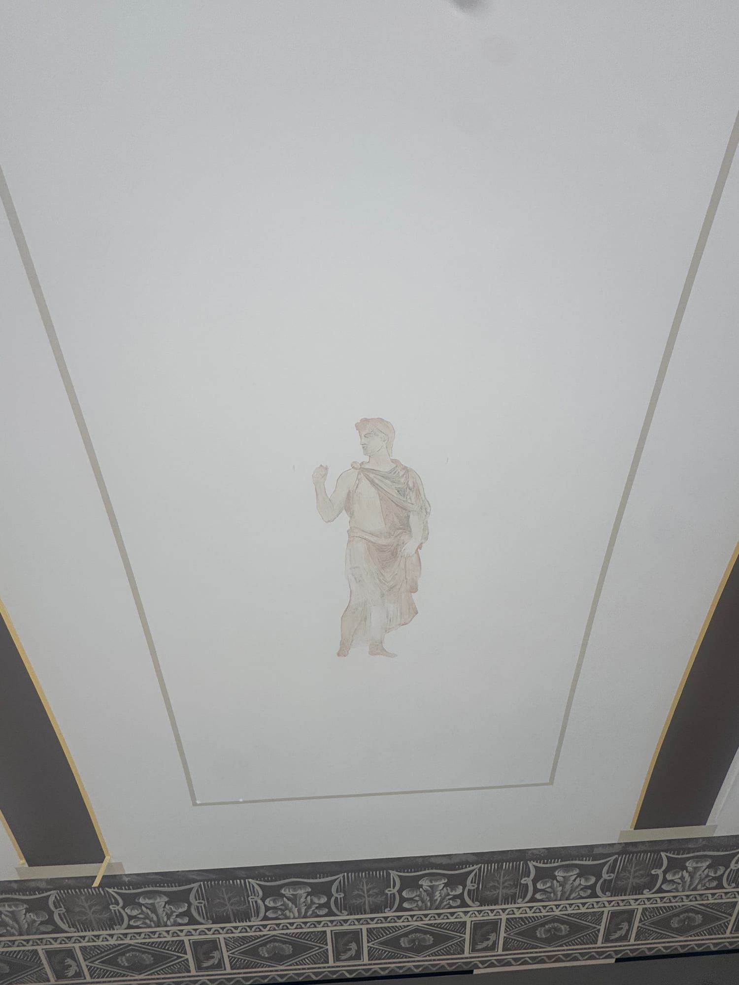 Ceiling panel with a figure painted in pale tones at an early stage, inside a thin painted frame
